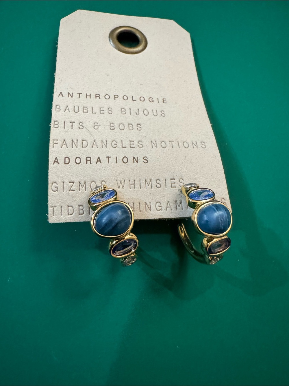 Anthropologie Gold Stone Hoop Earrings
Vibrant blue